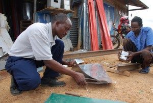 Workshop on making metal silos for grain storage, Kenya